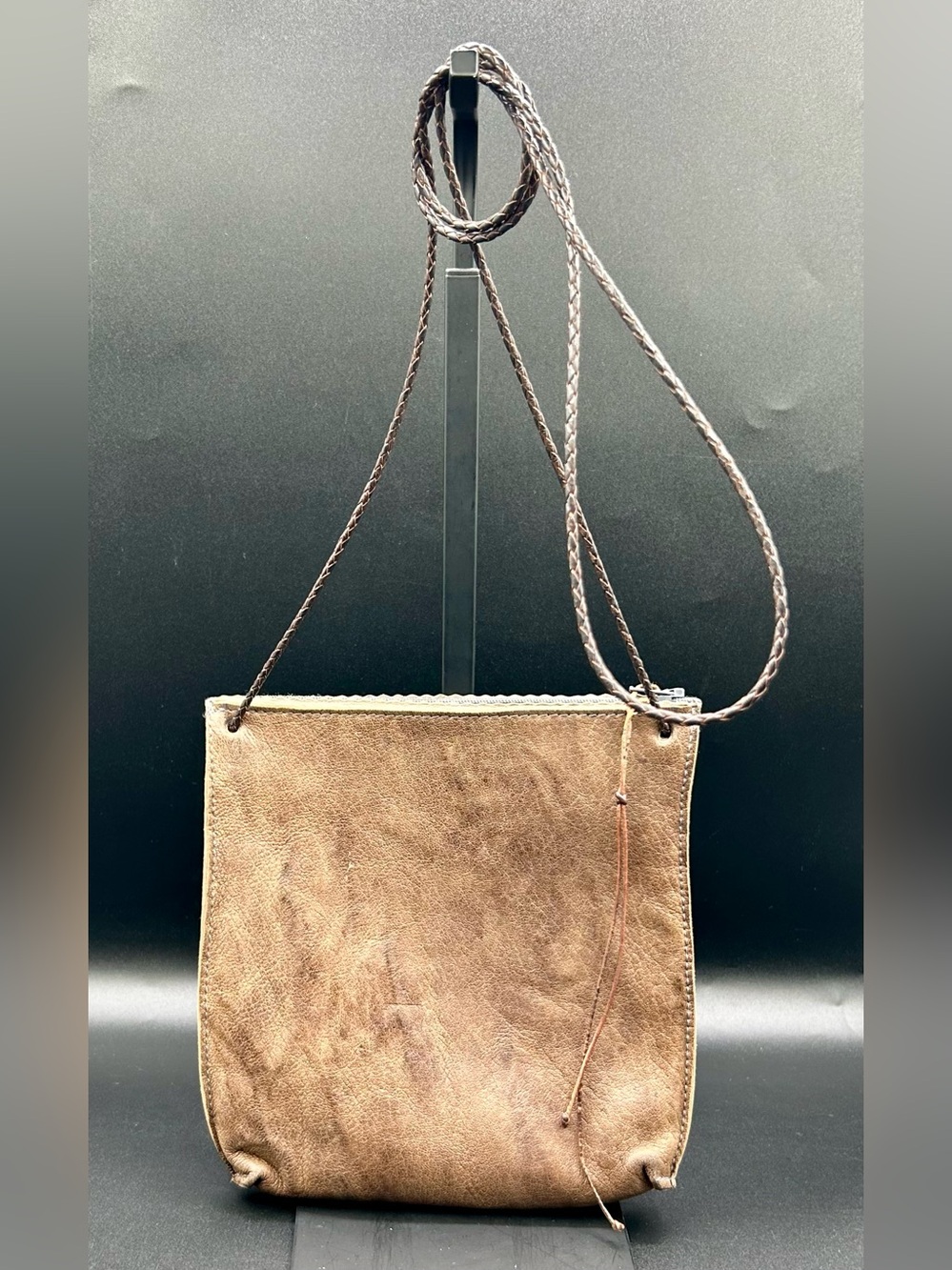 B. MAY Strappy Pouch Leather Crossbody Bag.